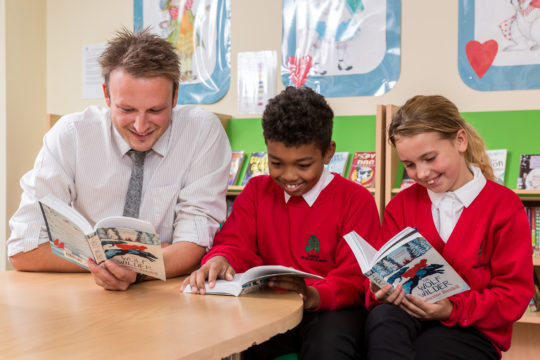 teacher and pupils reading