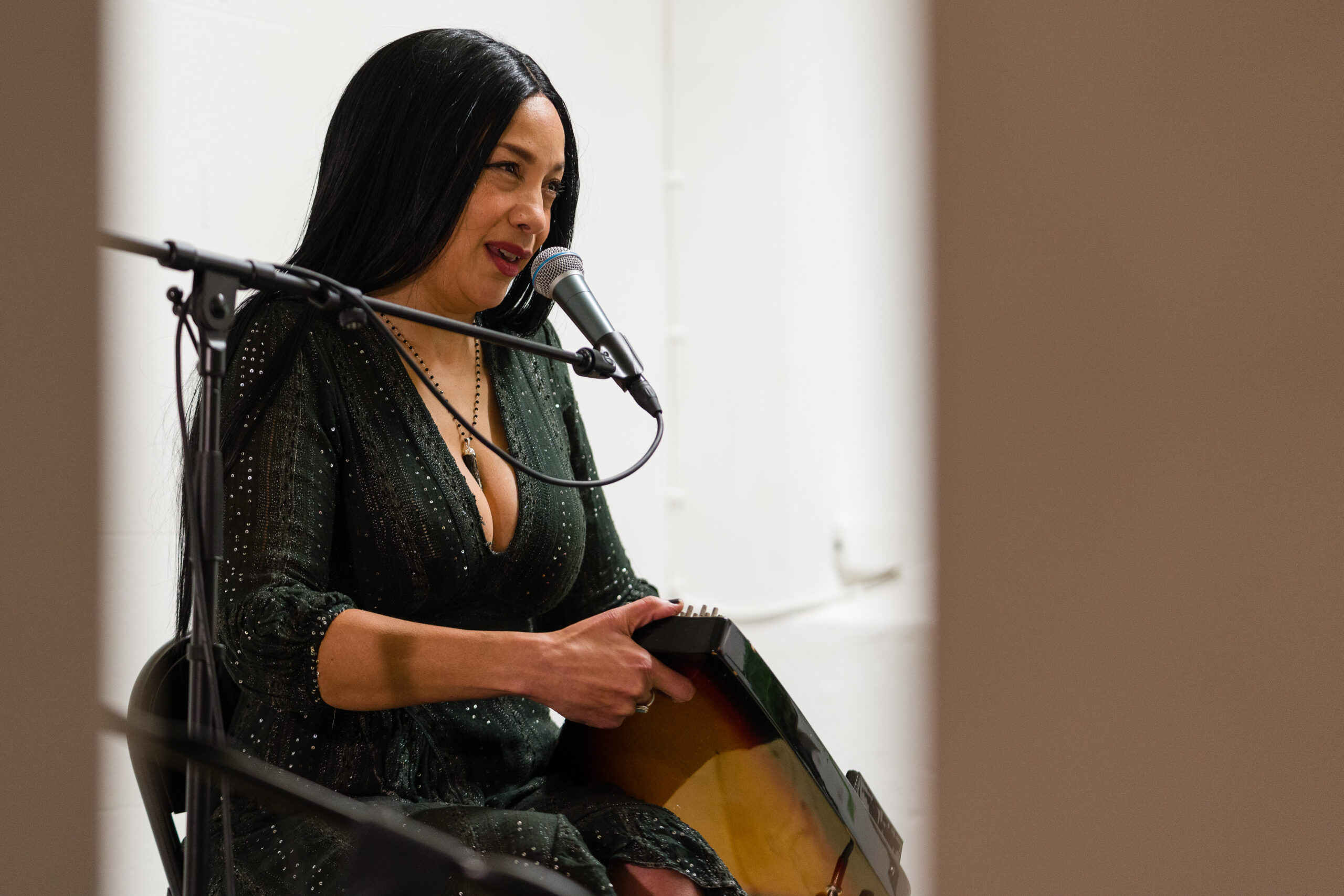 Angeline Morrison sings into a mic